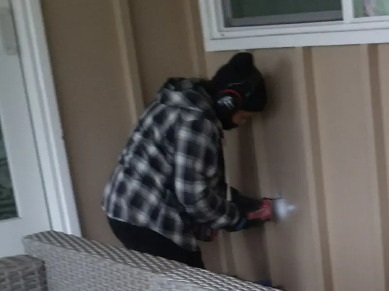 Professional electrician installing an exterior outlet in Eufaula